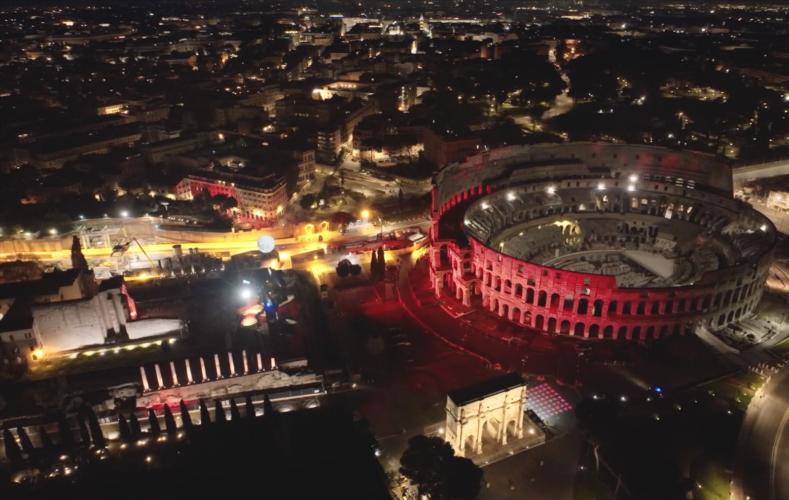 Aerial view of the Colosseum lit in red during Abbagnato's performance