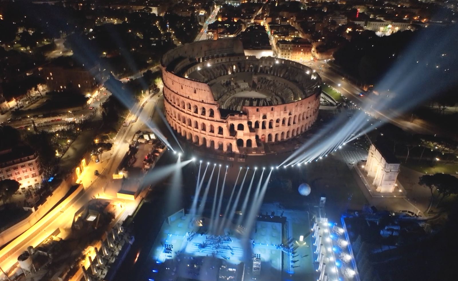 HUMANLANDS — Eternal Evolution: aerial view of the Colosseum illuminated for Expo Roma 2030