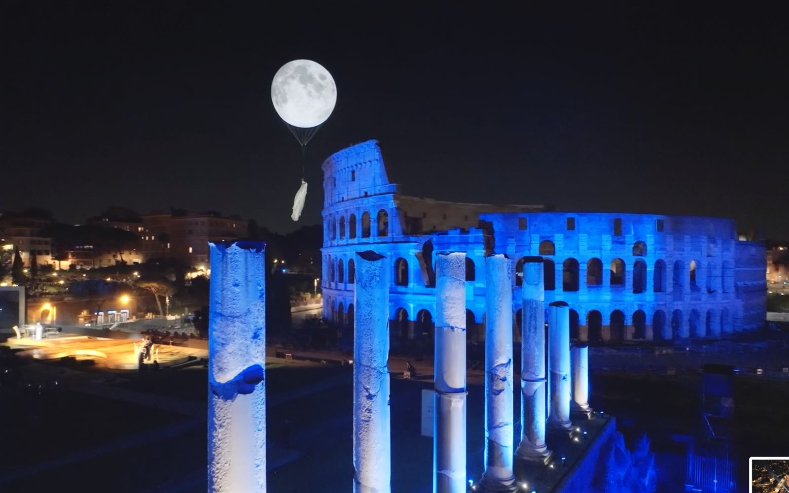 Colosseum and Roman Forum illuminated in blue with moon installation